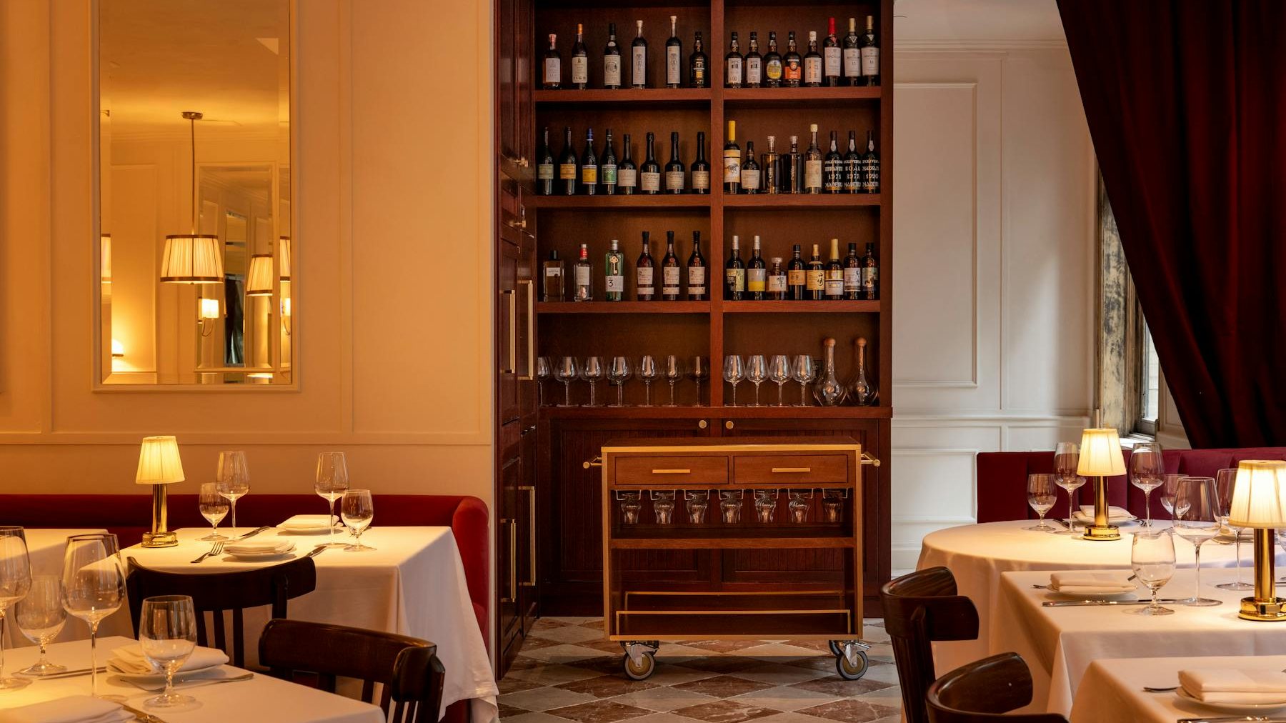 The wine cabinet and candlelit tables at Chateau Royale